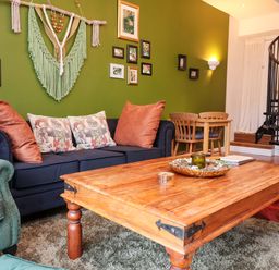 A living room with a sofa and coffee table at The Coach House, The Grove Combe Martin