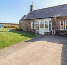 A house with a garden and pathway at The Retreat in Embleton