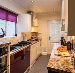 A kitchen with countertop appliances and food on the counter at Heathfield in Keswick