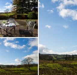 An outdoor patio with a table and chairs on a paved area overlooking a green landscape with trees and hills at Honister Cottage in Ambleside