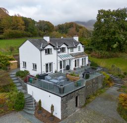 A house with a balcony and garden at Goody Raise in Grasmere