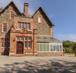 An exterior view of a house with a conservatory at South View Keswick
