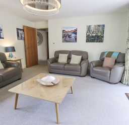 A living room with a coffee table and sofas at No 7 in Ambleside