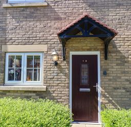 An entrance with a door and window at Driftwood in Filey