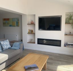 A living room with a sofa and coffee table at The Nest in Beadnell