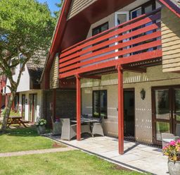 Exterior view of houses with balconies patios and garden furniture at 32 Trevithick in Hayle