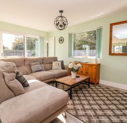 A living room with a sofa and coffee table at Bluebell Wood in Brandesburton