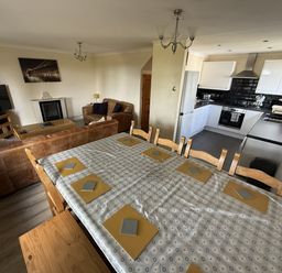 A dining room with a table and chairs in Hembry Meadows Honicombe Park near Gunnislake