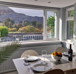 A dining room with a table set for a meal at Bryn in Bethesda