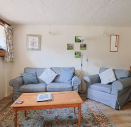 A living room with a sofa and coffee table at The Old Bakery in South Perrott near Mosterton