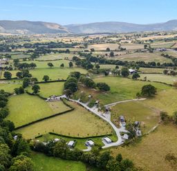 A landscape view of fields and houses at The Fox Den Nantmel near Rhayader