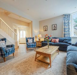 A living room with seating and a coffee table at Home Farmhouse at the Graythwaite Estate near Hawkshead