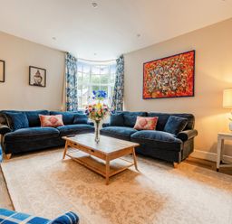 A living room with sofas and a coffee table at Home Farmhouse at the Graythwaite Estate near Hawkshead