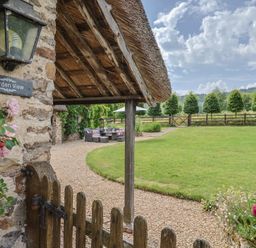 An outdoor area with a gate and seating at Garden View in Wellington