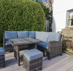 A seating area with a sofa and table at Tresawle in Crantock