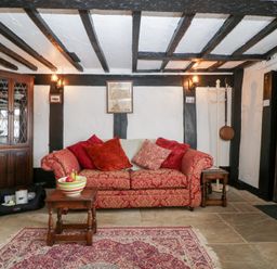 A living room with a sofa and coffee table at Avonmede in Tewkesbury