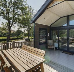 An outdoor area with a table and chairs at Hares Rest in Nantmel near Rhayader