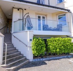 An outdoor area with stairs and a balcony at Ocean View Apartment in Colwyn Bay