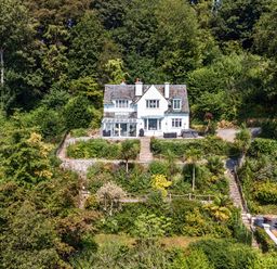 A house surrounded by greenery with a garden at Afallon in Menai Bridge