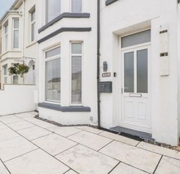 A front entrance with a door and mailbox at 76A Mackworth Road Porthcawl