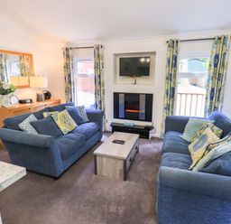 A living room with a sofa and coffee table at Forest Pines Lodge Beech Hill 10, Fallbarrow Park near Bowness on Windermere