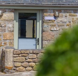 A door on a stone building at Scilly Stack in Penzance