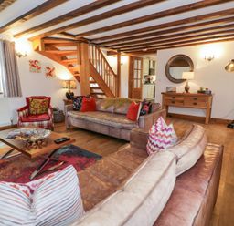 A living room with sofas and a coffee table at Greffyn in Betws-Y-Coed
