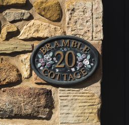 A house sign displaying Bramble Cottage 20 in Akeld near Wooler