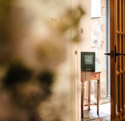 An entrance with a table and information booklet at Bramble Cottage near Wooler