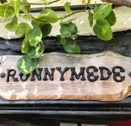 A sign with the name Runnymede at Runnymede in Tewkesbury