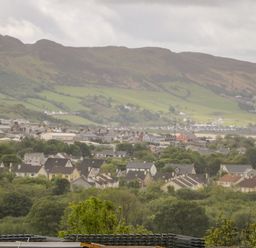 A town with houses and trees with hills in the background at Wee Andy's in Slavary near Buncrana County Donegal