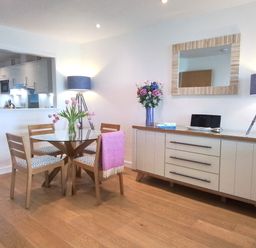 A dining room with a table and chairs at Sea Mist in Carbis Bay