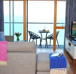 A living room with a view of the sea at Sea Mist in Carbis Bay