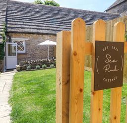 A sign at the gate of Sea Pink Cottage in Langton Matravers