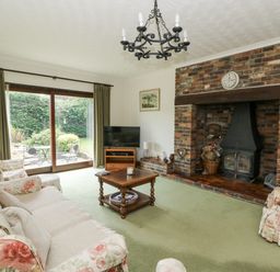 A living room with a television and fireplace at Kala Spittal near Haverfordwest