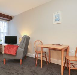 A living room with a sofa and table at Beck View