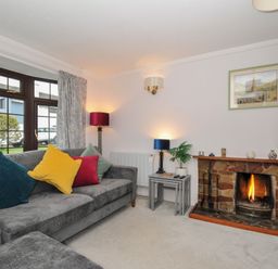 A living room with a sofa and fireplace at Hazelhurst in Rock