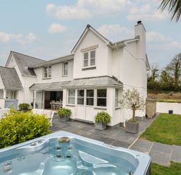 A house with a hot tub and patio area at Cherrytrees in Rock