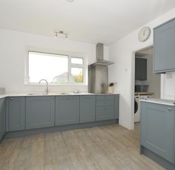 A kitchen with cabinets and a sink at Corriana in Rock
