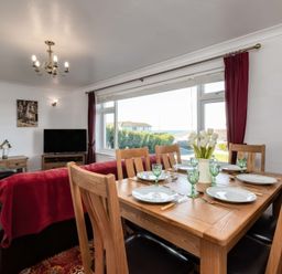 A dining room with a table set for dinner at Hillview Polzeath