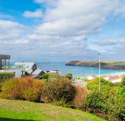 A view of houses and the ocean at Windyhill in Polzeath