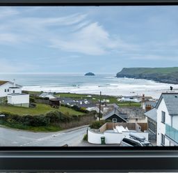 A coastal view with houses roads and a beach in the background at Pinewood 14 Polzeath