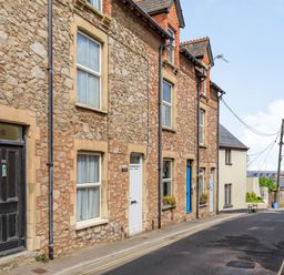 A street with stone houses and doors in different colors at Sea Spray in Watchet