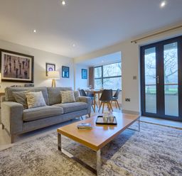 A living room with a coffee table and a sofa at Riverside Park 1 in Keswick
