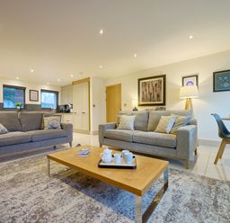 A living room with sofas and a coffee table at Riverside Park 1 in Keswick