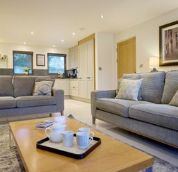 A living room with a sofa and coffee table at Riverside Park 1 in Keswick