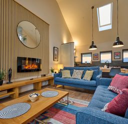 A living room with a sofa and coffee table at Riverside Park 5 in Keswick