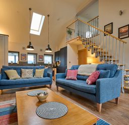 A living room with sofas and a coffee table at Riverside Park 5 in Keswick