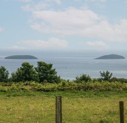 A view of two islands across the sea at Bryn Awel in Mynytho near Abersoch