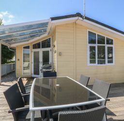 An outdoor dining area with a table and chairs at The Warren D26 Abersoch